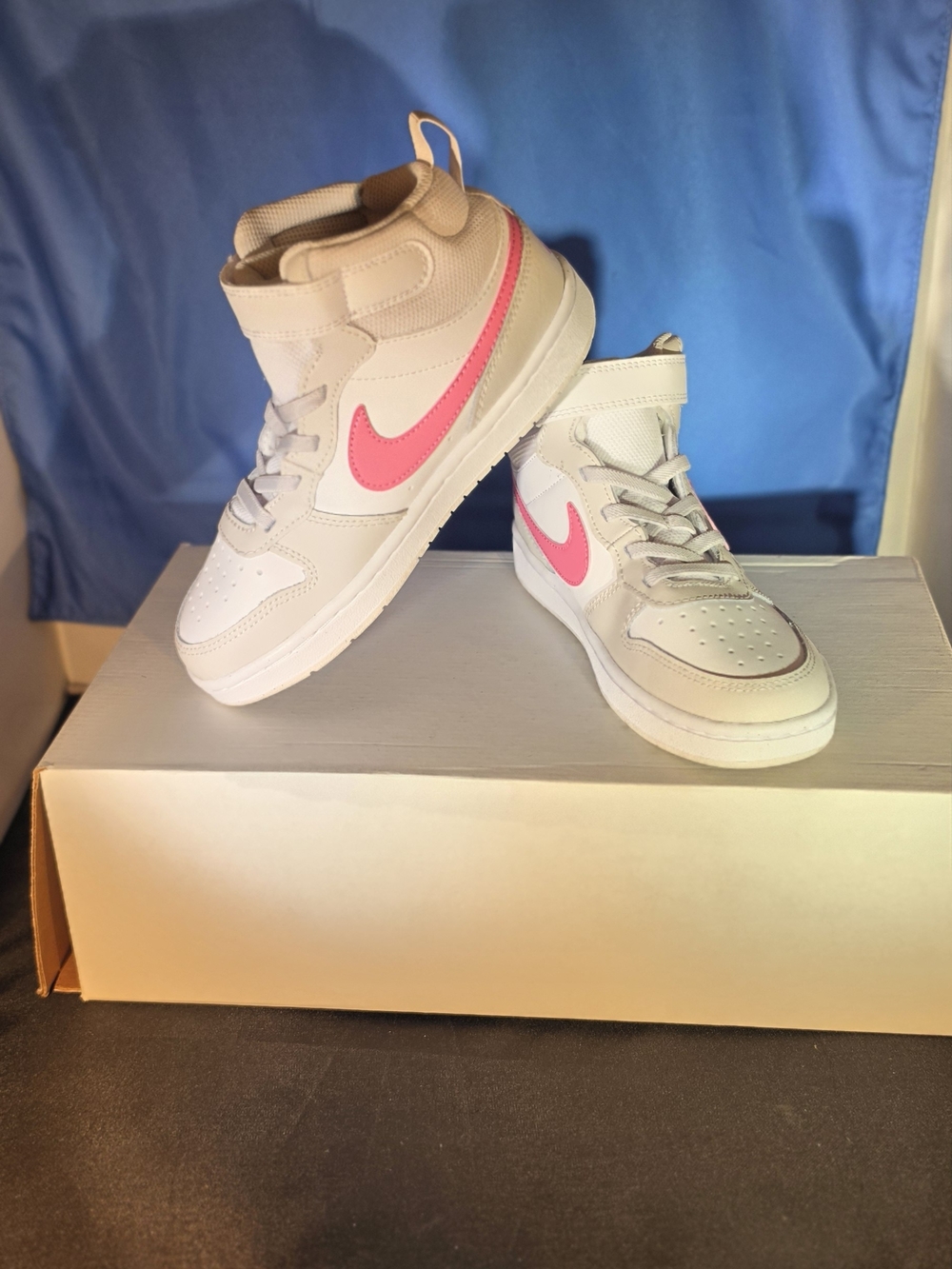 Nike Kids Mid-Top Sneakers in White with Pink Swoosh